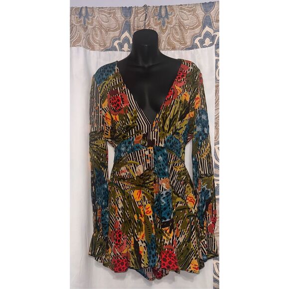 Free People Pants - Beautiful printed Free People Audrey Romper romper featuring a plunging neckline